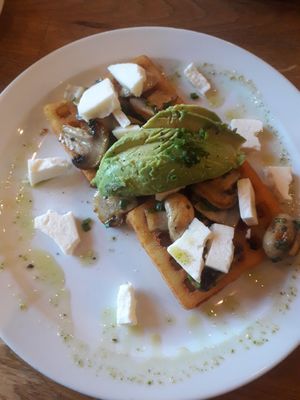 Vegan potato waffles with feta, mushrooms, avocado at Wanderlust Cafe & Bistro in Edinburgh