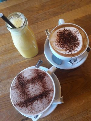 Hot chocolate with oatmilk, cappuccino, orange juice at Wanderlust Cafe & Bistro in Edinburgh