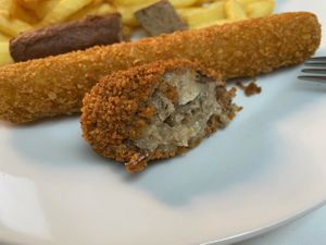 Fries with Vegetarian frikandal, chicken crunchy and vleeskroket. at De Blauwe Frituur in Kortrijk