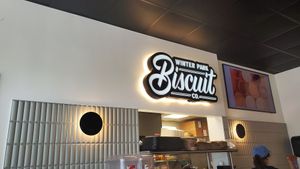 sign and kitchen at Winter Park Biscuit Company in Orlando