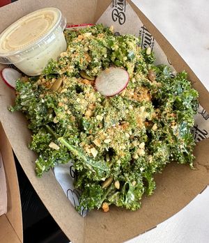 Kale side salad w/extra Caesar dressing   at Winter Park Biscuit Company in Orlando