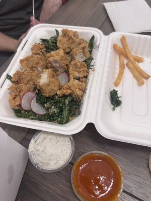 Kale salad with chicken tenders  at Winter Park Biscuit Company in Orlando
