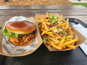 Crispy chick sandwich with loaded fries at Winter Park Biscuit Company in Orlando