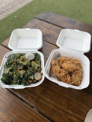 Side of kale salad and chicken tenders  at Winter Park Biscuit Company in Orlando