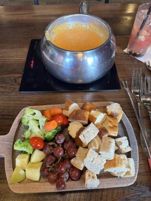 Vegan cheese fondue with bread, pretzel, grapes, carrots, tomato, apple and broccoli - delicious!  at The Melting Pot in Oklahoma City