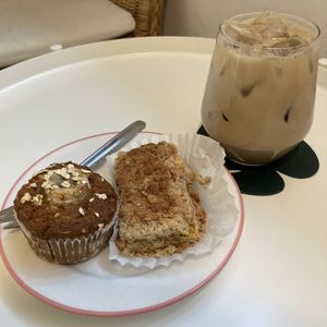 Banana oatmeal brown rice muffin, mango banana peanut butter crumble, and a vanilla latte  at Vegan Vanilla Bakery in Daejeon