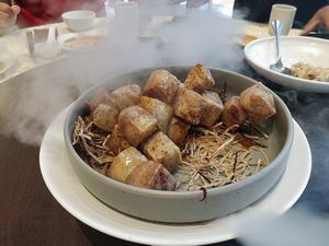 Caramelised Yam Dices with Raw Sugar. 
Smoke by the sides are from dry ice.  at Lotus Vegetarian 莲心 - Novena in Central Singapore