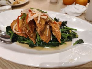 sauteed spinach with crispy goldenn dumplings at Lotus Vegetarian 莲心 - Novena in Central Singapore