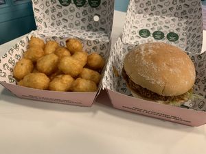 Tater tots and vegan chick’n burger with buffalo sauce  at Neat - Camden in North West London