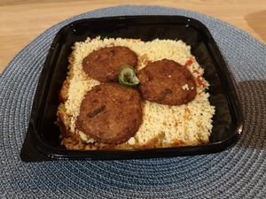 Burger patties on couscous at Vegebar in Belgrade