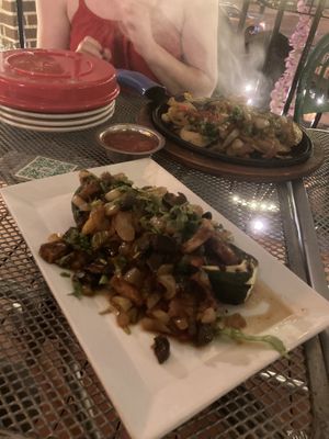 Stuffed zucchini with sizzling portabella veggie fajitas in the background   at Laredo in Washington