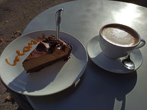 Bailey's tarte and oat-milk cappuccino at Creamy Cafe in Lublin