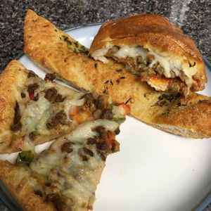 We ordered pizza, garlic bread, and a calzone. Delicious! at Sarpino's Pizzeria in Fort Lauderdale