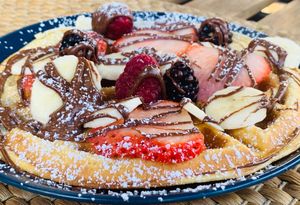 Homemade waffles with fruits and a range of delicious topping at L' Epicerie Moderne in Lourdes