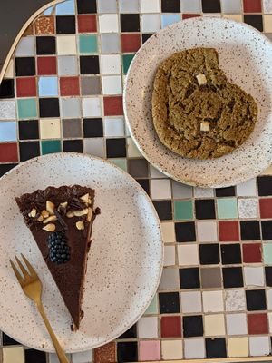 Chocolate caramel cake and matcha cookie at Eter Vegan Bakery in Warsaw
