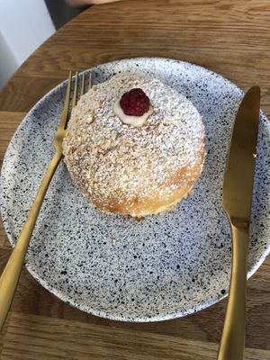 traditional pastry with vanilla cream and raspberries  at Eter Vegan Bakery in Warsaw