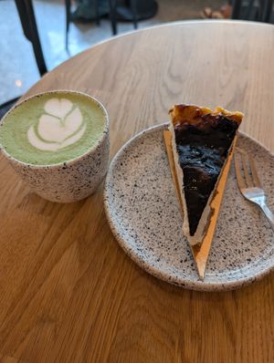 Matcha latte and cheesecake at Eter Vegan Bakery in Warsaw