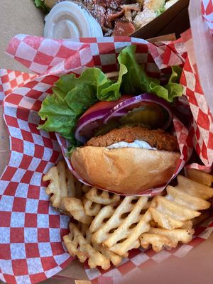 Chick-eel O'Neil with spicy sauce and a side of fries. at Bring Me Some in Hamilton