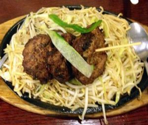 Teriyaki noodles with beef on hot plate at 4 Stones Vegetarian Cuisine in Richmond