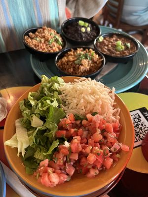 Fajita toppings of vegan cheese, lettuce, and tomatoes along with sides of rice and beans   at Mother's Cantina - Philadelphia in Ocean City
