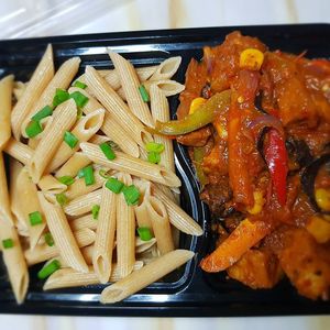 Whole wheat penne pasta and Tofu stew with peppers, carrots and mushrooms. at Michele's Vegan Kitchen in Lagos