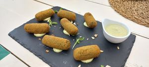 Green croquettes with a garlic sauce to die for! at Cocos Veggie e Tal in Foz Do Arelho