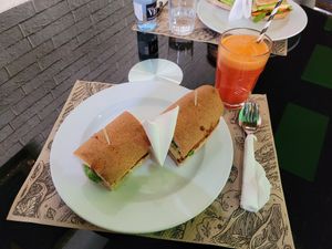 Tofu Sandwich an Orange Carrot juice. at Vegan Food Heaven in Barcelona