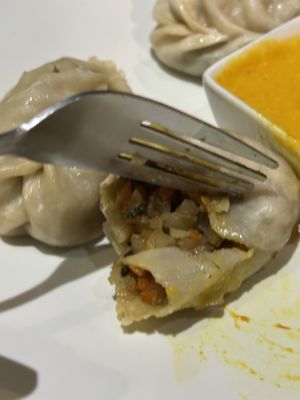 Vegetable dumplings cut  at Vegan Food Heaven in Barcelona
