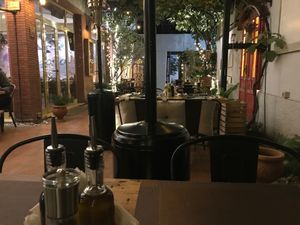 The garden patio dining area at Ejona in Tirana