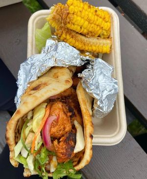 A Vegan Shicken Tikka naan wrap with a side of corn ribs 😋 at SHICKEN -  Foodtruck in East London