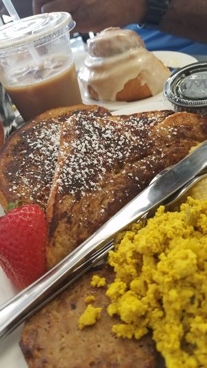 Brunch. Homemade french toast, tofu scrambled and Beyond sausage patty. Iced coffee. Cinnamon bun. at JMT Vegan Eats in Virginia Beach