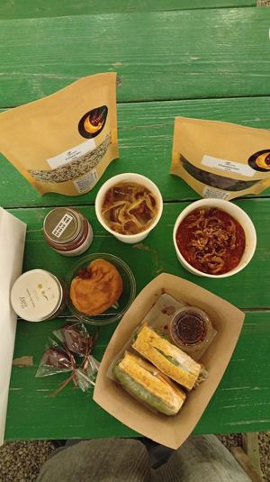 Noodles, cranberries, doughnut, tofu sandwich, chocolate date, walnut chocolate spread: all vegan 🤤 at Torba Farmers Market  in Doha