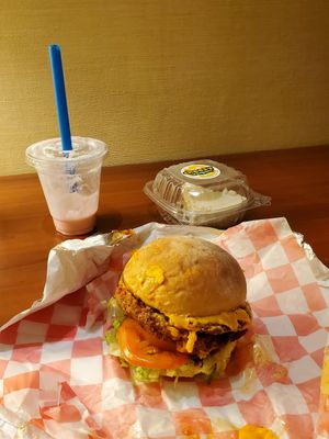 Nashville Hot Spicy Chik'n sandwich + strawberry shake + slice of cheesecake at Cheezy Vegan in Woodlyn