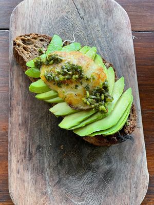 Avocado toast with vegan cheese and pesto at Botanica Garden Cafe in Tulum