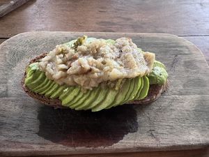 Avocado toast with vegan potato cheese   at Botanica Garden Cafe in Tulum