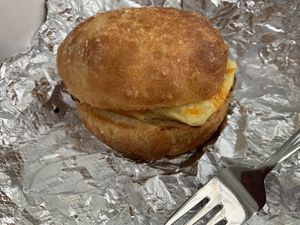 Salty roll with just egg, cheddar cheese and vegan ham at Tree Town Cafe in Penfield