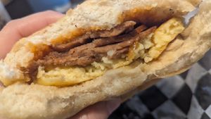 "The Superior" breakfast sandwich with just egg, vegan cheddar and ham from grass fed at Tree Town Cafe in Penfield