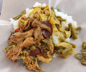 Rice with curry vegetables, bitter gourd, stewed burncurd knots, vegetable fritters for $2.50 😍 at Ju Fu Yuan Vegetarian Delight 聚福缘素食 - Blk 11 Upper Boon Keng in Central Singapore