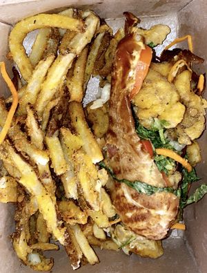 Poboy sandwich with seasoned fries  at The Vegan Club in Cleveland