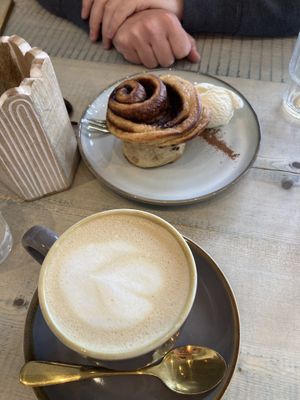 Warm cinnamon bun with vanilla ice cream + latte    at The Vibe in Liverpool