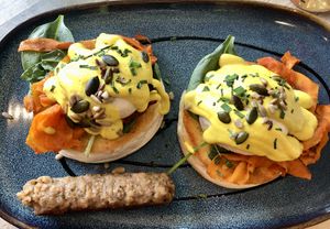 Veggs royale with side sausage  at The Vibe in Liverpool