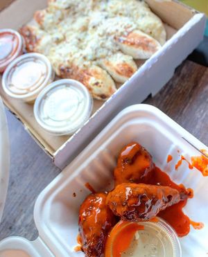 Cheesy breadsticks and wings at Love Amaro Pizzeria in Venice