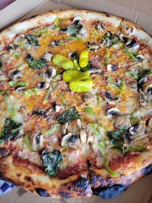 Very large pizza with mushrooms and peppers at Love Amaro Pizzeria in Venice