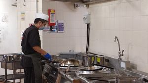 The chef in the kitchen at The Social Kitchen - Jurong Bird Park in West Singapore