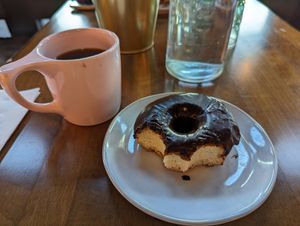 Hot drip coffee and vegan chocolate donut at Landlocked Baking Company in Indianapolis