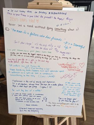 Whiteboard with affirming messages at The Little Poet in Hobart