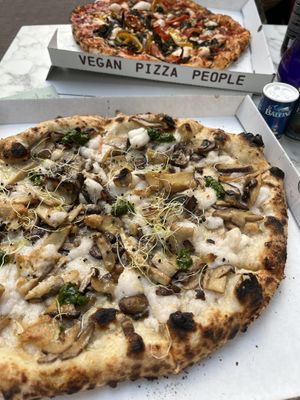 Pizza tutto mushroom (front) and pizza il bacio (back)  at Mastino Pizza in Amsterdam