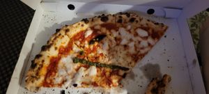 Phone died. Half eaten margarita 😋 at Mastino Pizza in Amsterdam