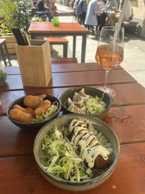 3 tapas - sushi roll, dumplings, and a fried ball.   at Ouai in Leipzig