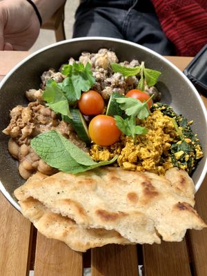 Harissa tofu scramble with garlic beans, garlic naan and all the trimmings  at Harry's Cafe & Bakery in Hepburn Springs